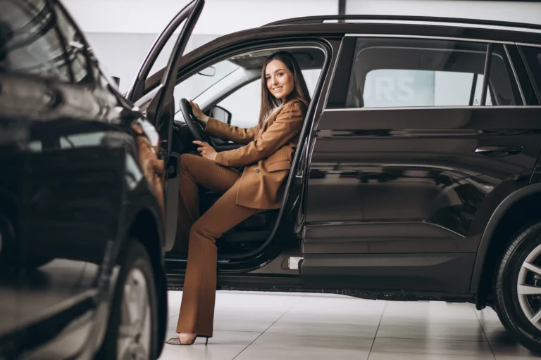 young-business-woman-sitting-car-scaled